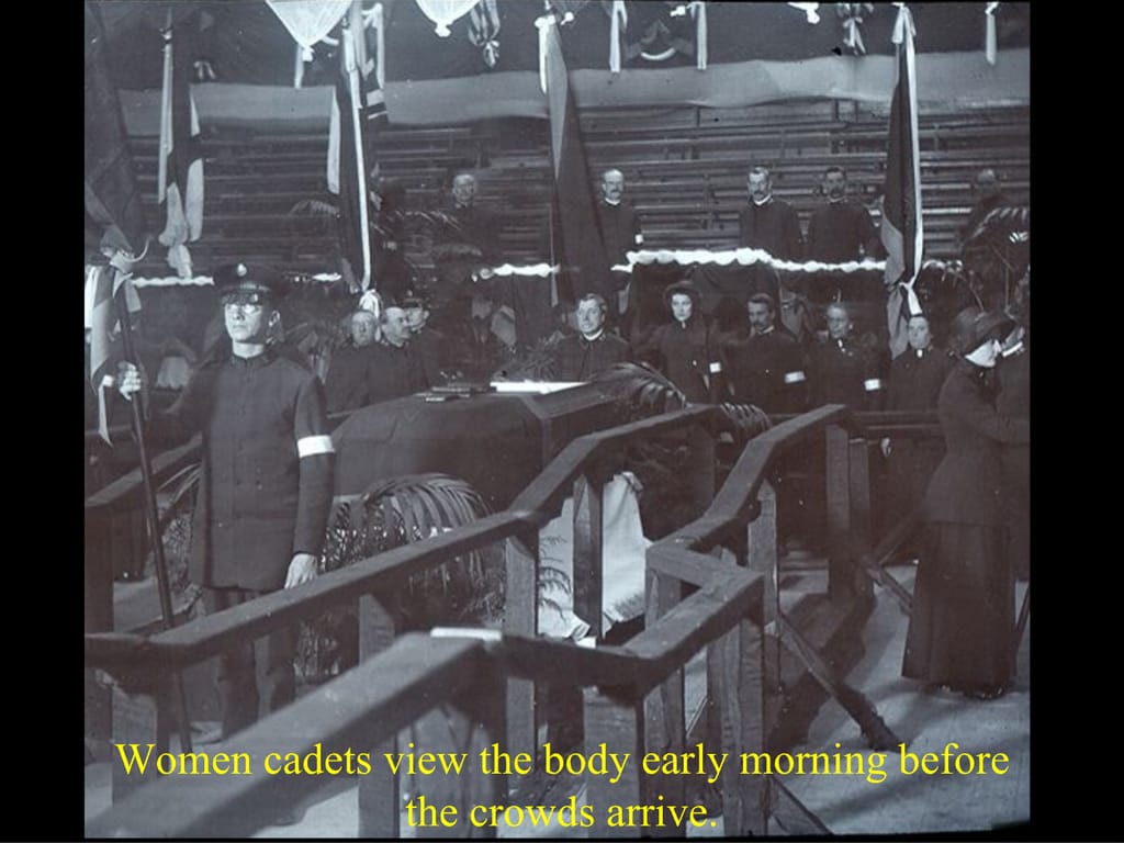 Women cadets view the body early morning before. the crowds arrive.